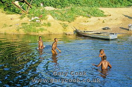 Boys washing in the river, Southern Cameroon